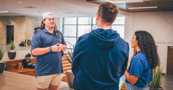 ETSU student tour guide giving an individual tour on campus