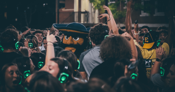 Bucky's head is sticking out from the crowd during a dance party.