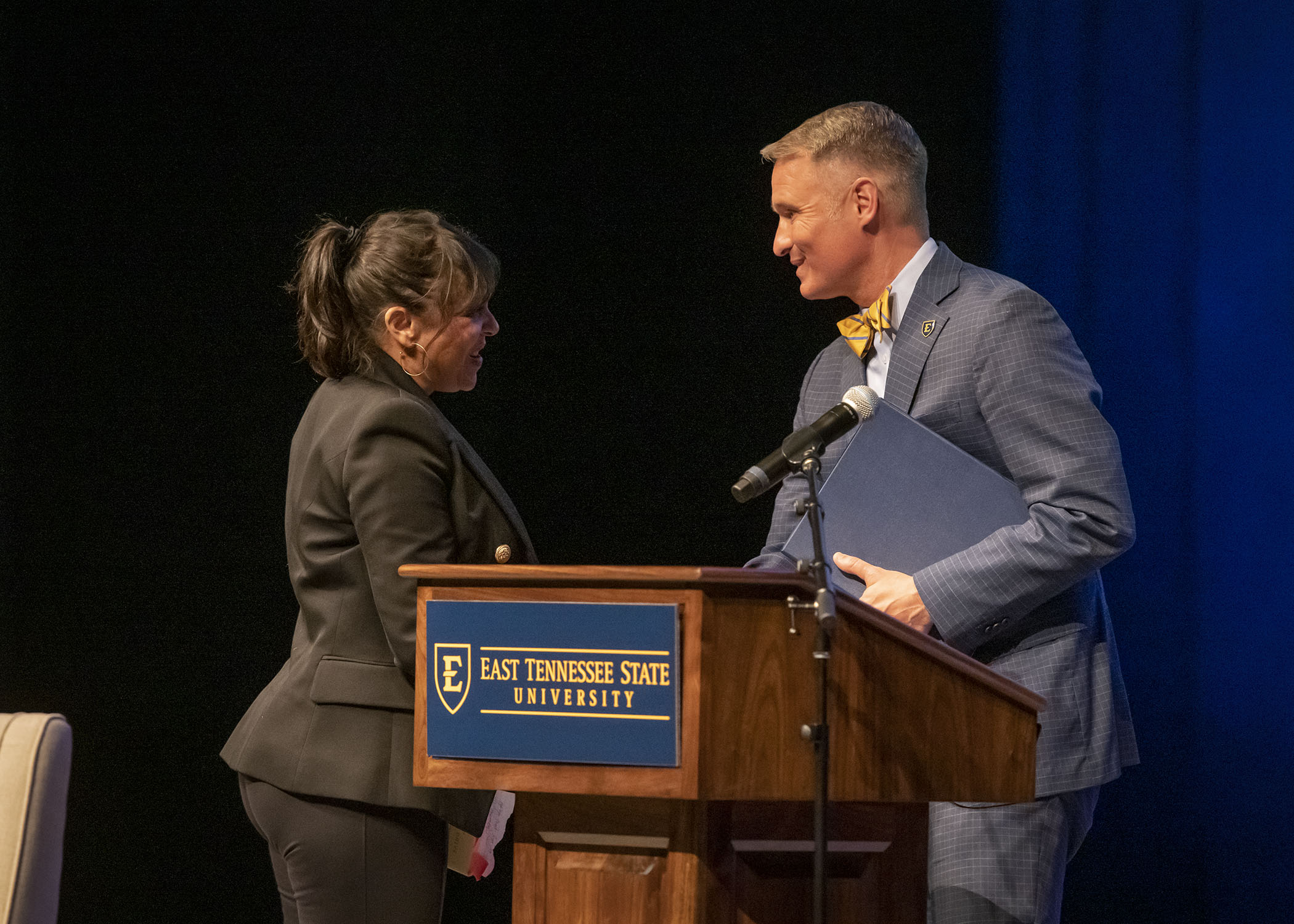 Natasha Trethewey shaking hands with Dr. Brian Noland