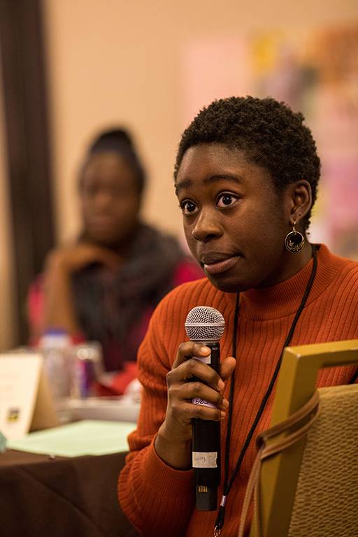 Female student holding a microphone