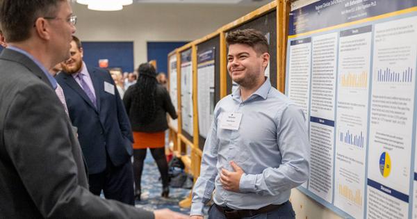 ETSU student presenting research to community members