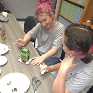 Students working on spooky cookie houses.