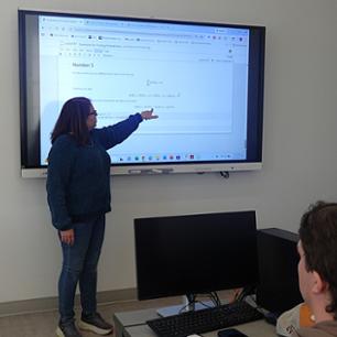 Students taking notes for stochastic modeling.