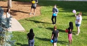 Dr. Milner with students in Advanced Developmental Psychology learning therapy activities for clients of all ages.