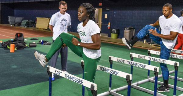 Olympic trainers at ETSU practicing hurdles