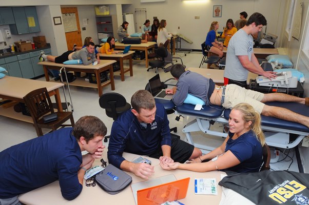 picture of students practicing what they learned in lab