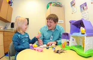 grad students working with a patient