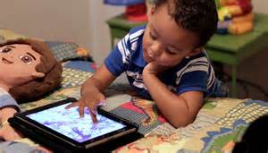 boy playing with ipad