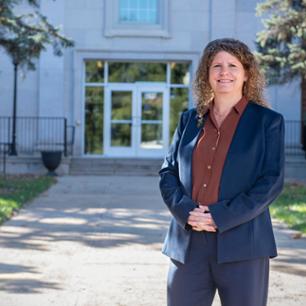 Janna Scarborough wearing a suit in front of Warf-Pickel
