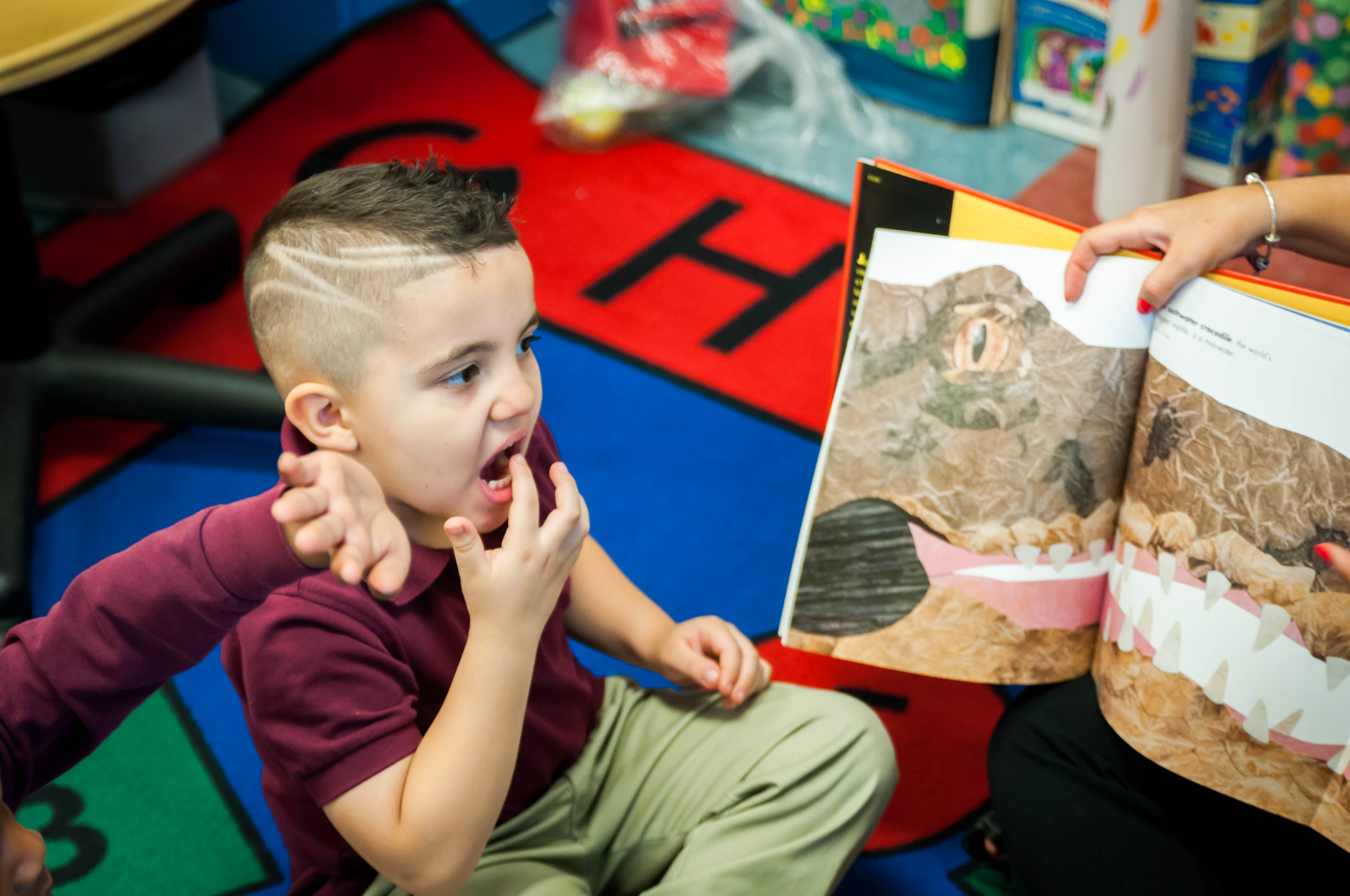 boy with book comparing teeth