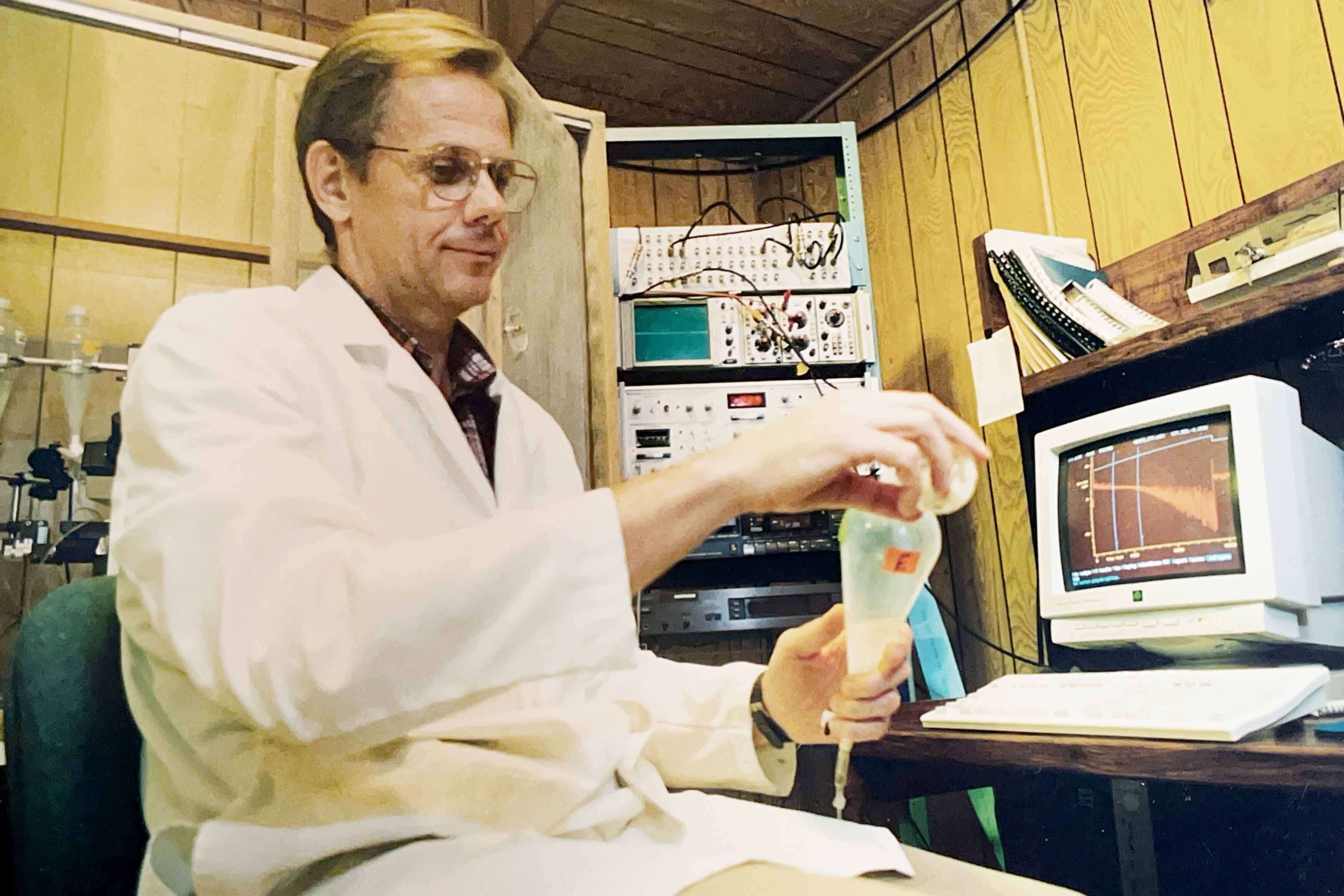 Professor conducts experiment in the old mini-dome lab