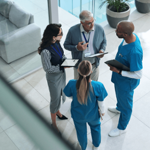 Doctors, medical team and tablet with discussion, advice and above for surgery or patient records. People, tech and nurse for professional opinion, help and results in healthcare, clinic or hospital.