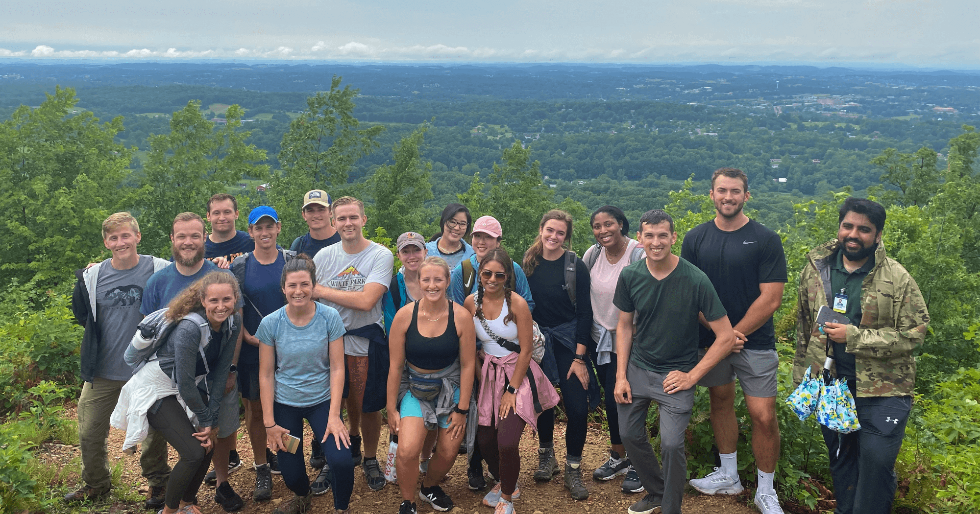 Group photo of Quillen M1 students in front of a scenic view.