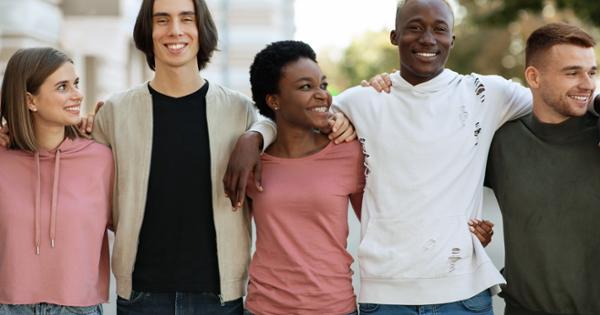 Group of young people with arms around shoulders