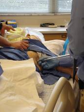 Chest tube being inserted by a medical student on a sim dummy.