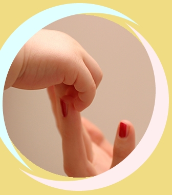 baby hand touching female hand