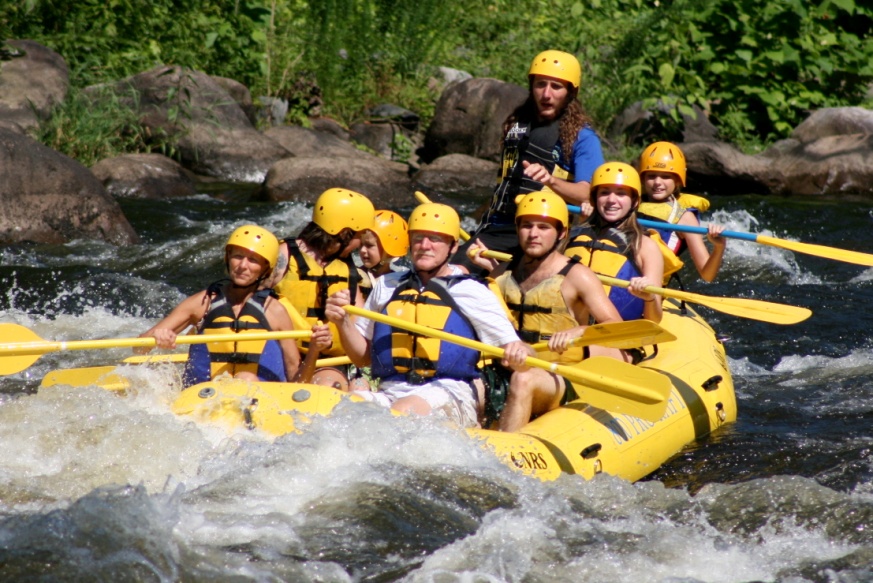 Randy Wykoff and Family on the Pigeon River in the Great Smoky Mountains of East Tennessee (Gregory Wykoff, alumnus of the College of Public Health, and current student at the Quillen College of Medicine, spent his college summers as a professional rafting guide in the Smoky Mountains.)