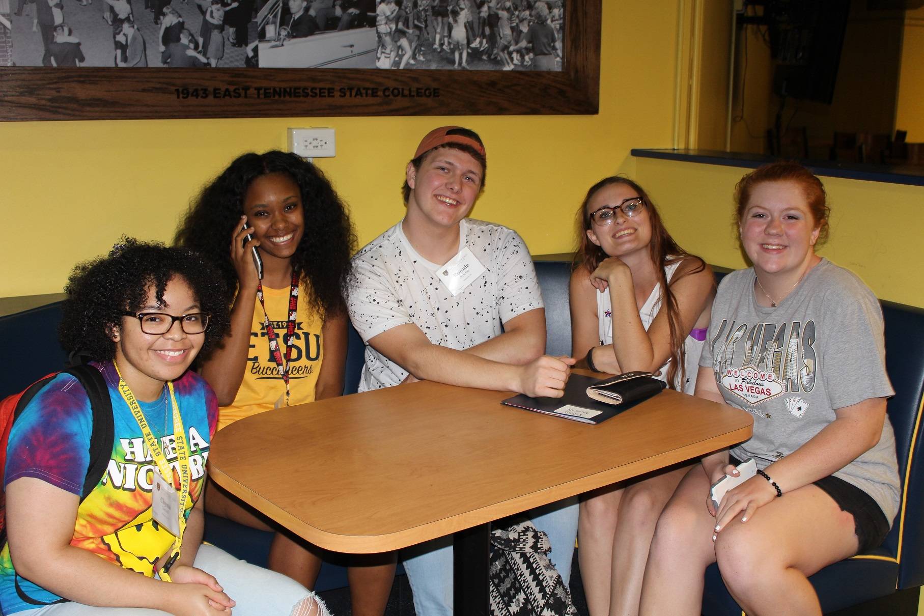 five students smiling