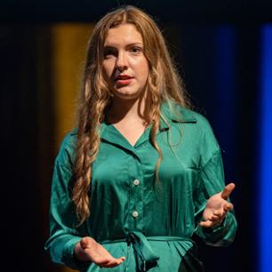 girl talking in green dress-suit