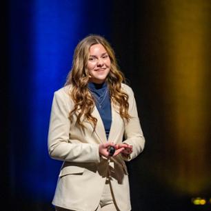 girl smiling in off-white suit