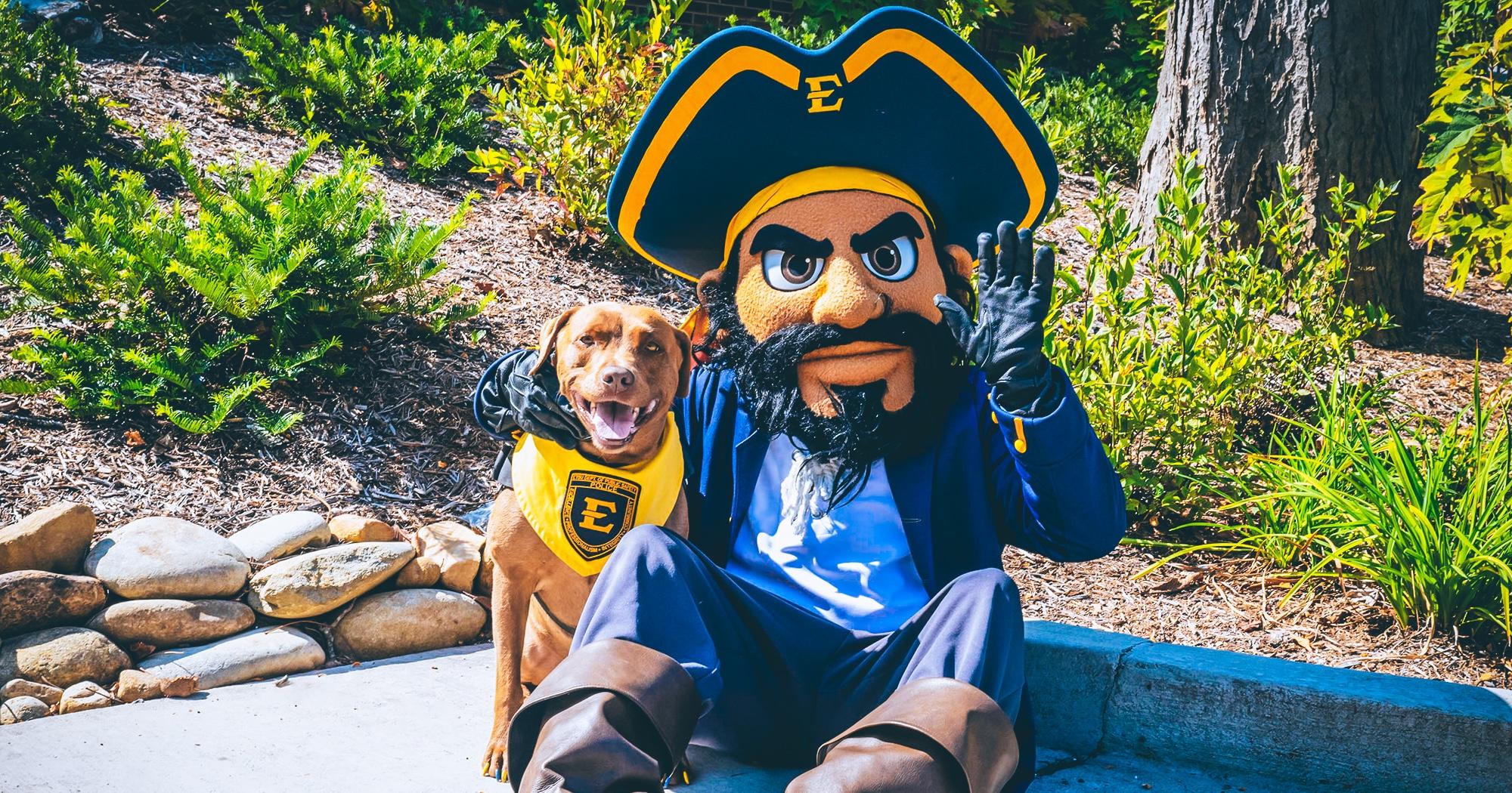 Outdoor oortait of ETSU's mascot, Bucky, and Pepper the dog