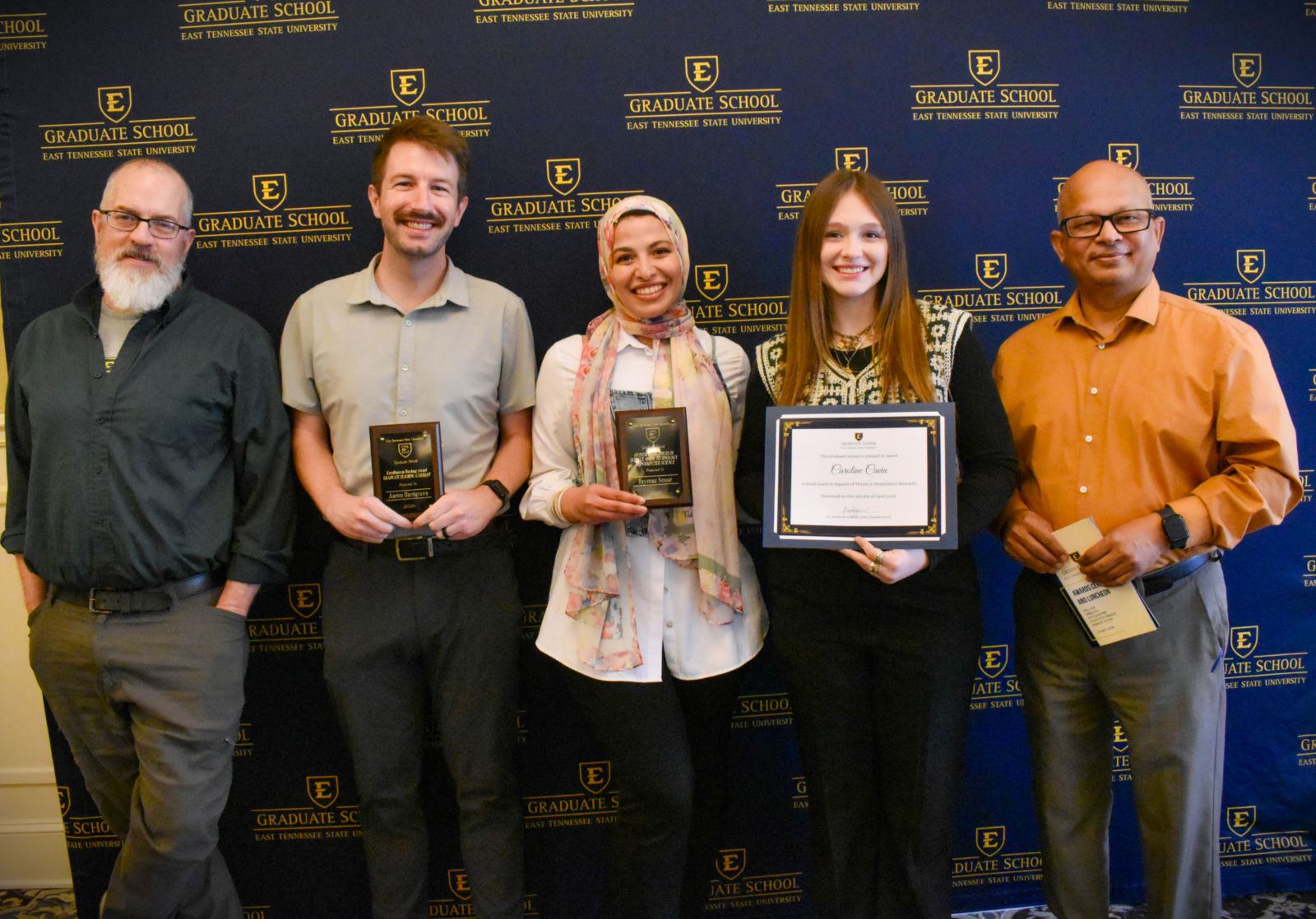 Biological Sciences faculty and graduate student award recipients posing together.