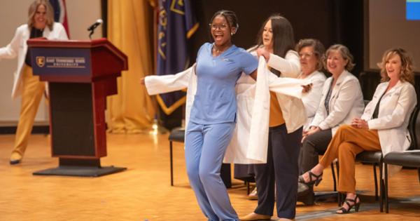 Ijeoma getting her white coat