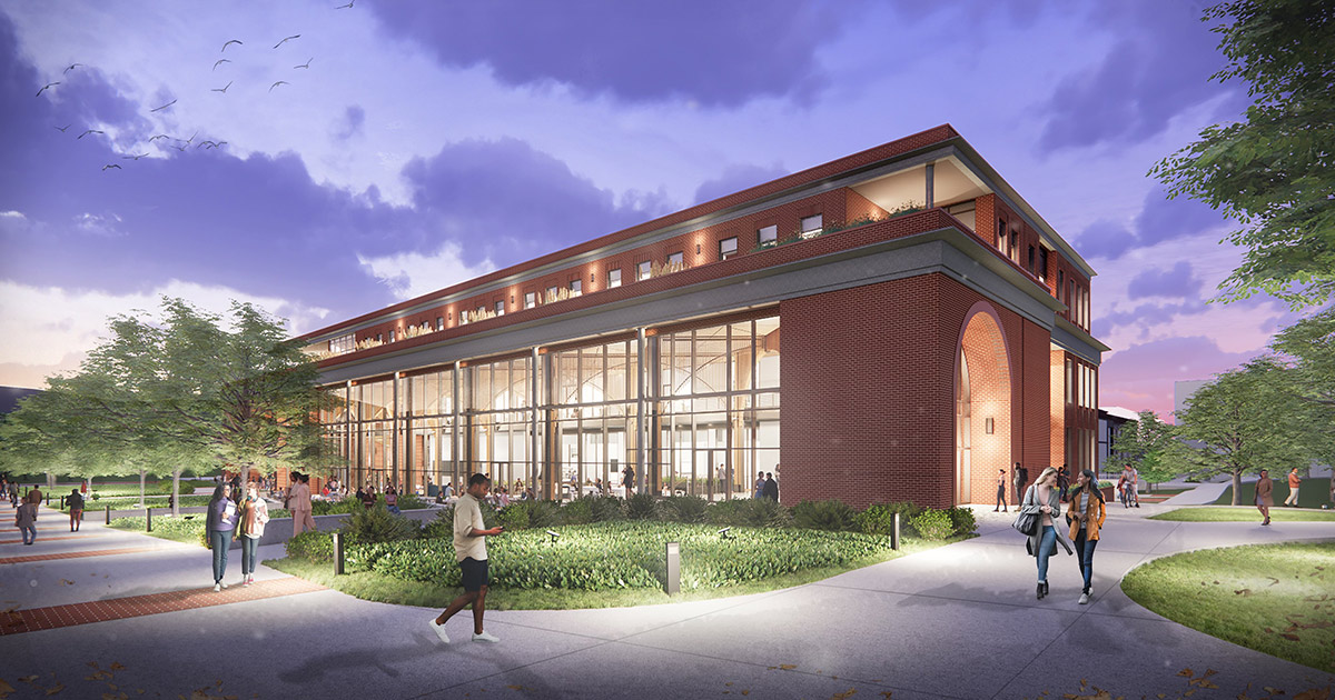 Architectural rendering of ETSU’s new academic building at dusk showing a red brick structure with a glass-walled commons glowing from interior lights. Students walk along landscaped pathways, gather on an outdoor patio, and enter through a tall arched doorway surrounded by trees and greenery.