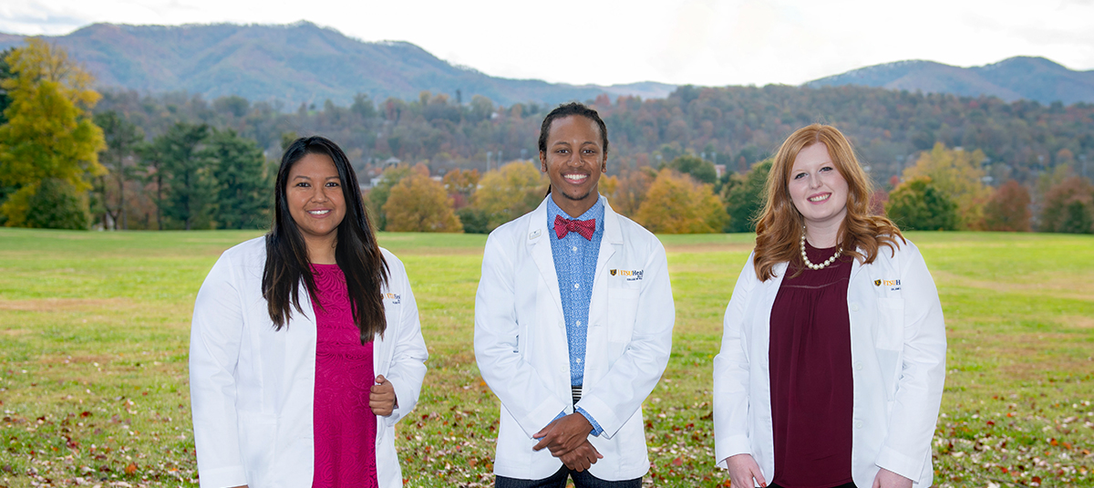 Students in front of mountains