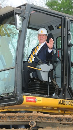 Scott Niswonger operating backhoe