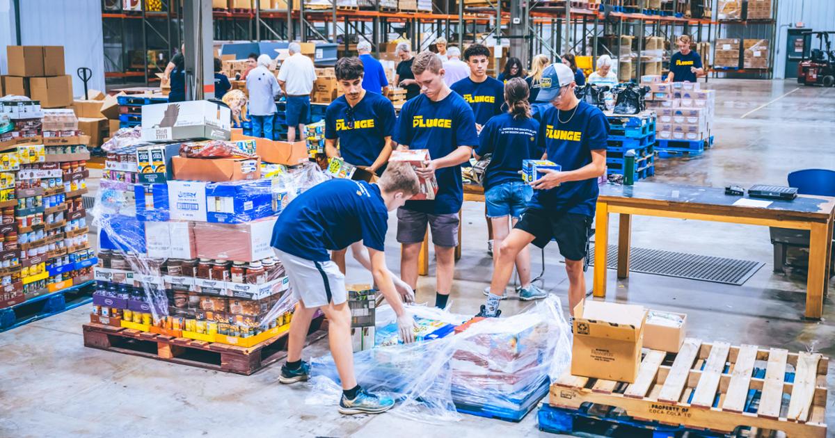 A group of ETSU students sorting donations