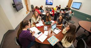 Students working together around a table in a classroom
