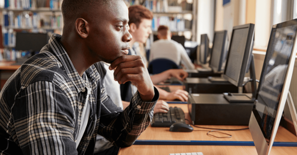 student at computer looking engaged