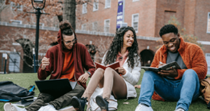 students talking on campus grounds